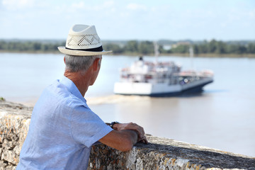 Tourist watching a ferry
