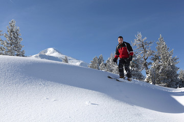 Naklejka na ściany i meble Male skier on a ski slope