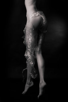 Naked girl, covered with plastic film 