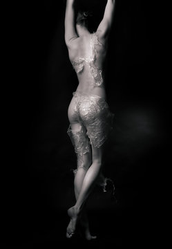 Naked girl, covered with plastic film 
