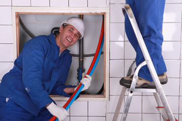 Workers installing a water system