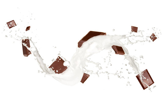 Chocolate bars in milk splash, isolated on white background