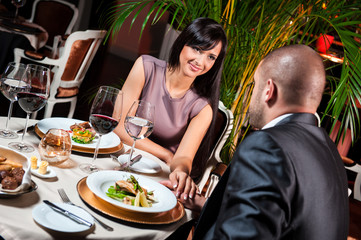 Beautiful couple in love at restaurant