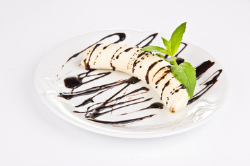 Banana with chocolate, isolated on white background