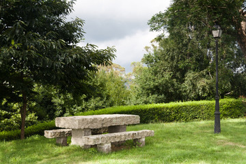 Lonely stone bench in a park