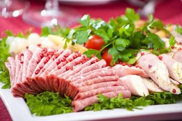 cold appetizer with ham, cheese and fresh salad