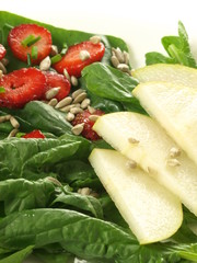 Pear and strawberry on spinach