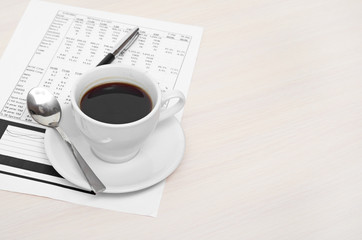 Accounting. Cup of coffee on document. chart and diagram
