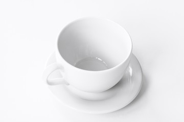 White teacup on white paper