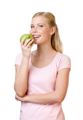 Young woman eating apple, isolated on white background