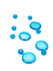 Blue round  beads and pebbles isolated on white