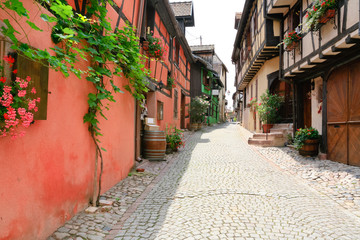 alley in medieval Riquewihr town, France