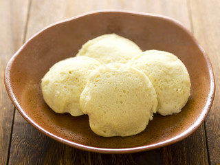 close up of a bowl of indian idlis