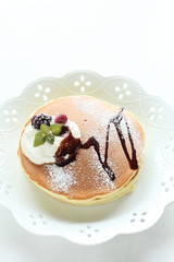 berries and chocolate sauce on Pan cake