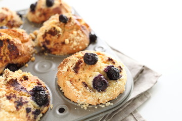Home bakery of blueberry muffin in mold with copy space