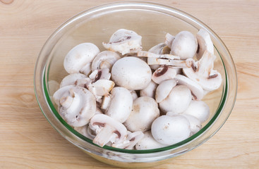 Bowl of sliced white mushrooms
