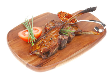 meat on wooden plate : roast ribs