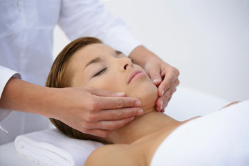 Fototapeta na wymiar Woman having face massage