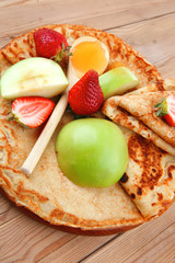 baked and fruits : pancake with honey and strawberries