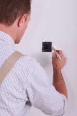 painter retouching wall