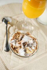 Cereal bowl with orange juice
