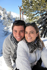 Couple skiing in the mountains