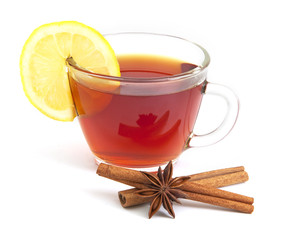 Cup of tea with lemon, anise star and cinnamon