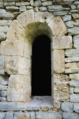 Fototapeta na wymiar window in the old stone wall