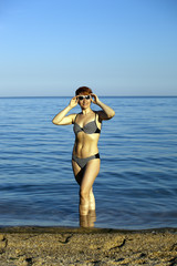 The harmonous woman on the seashore