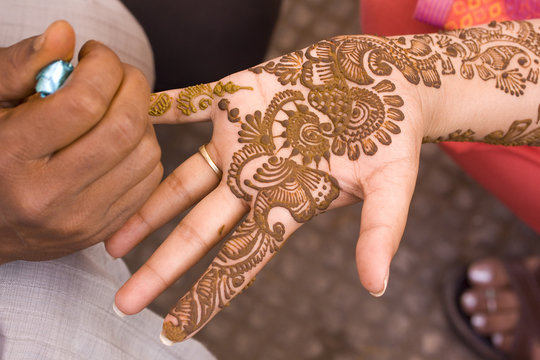 applying henna on hand, bride , traditional Hindu wedding , Rajasthan, India