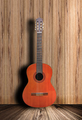 Acoustic guitar with wooden background