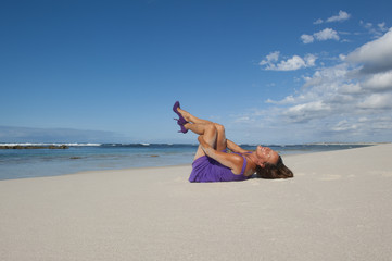 Sexy woman purple dress and shoes at beach