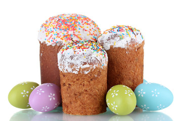 Beautiful Easter cakes and colorful eggs isolated on white