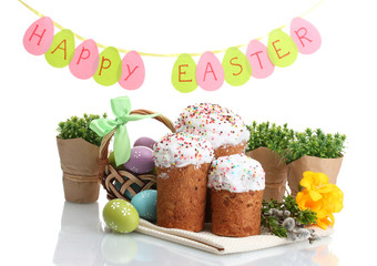 Beautiful Easter cakes, colorful eggs in basket and
