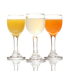Tropical juices in glasses isolated on white