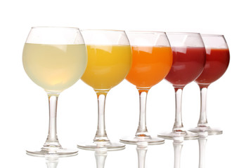 Tropical juices in glasses isolated on white