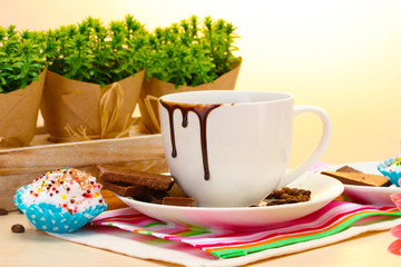 dirty cup of coffee and gerbera  beans, cinnamon sticks