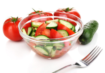 Fresh salad with tomatoes and cucumbers isolated on white