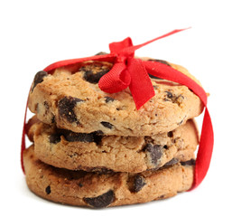 Chocolate chips cookies with red ribbon isolated on white.