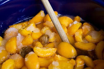 apricots mixed with sugar in a pot