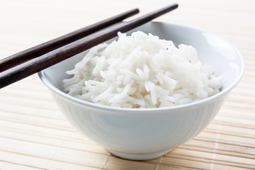 Long grain rice bowl with chopsticks