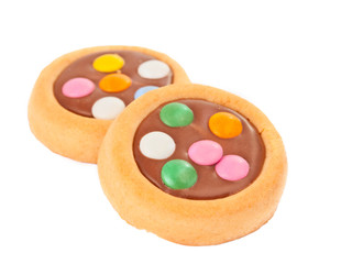 Obraz na płótnie Canvas Biscuits with milk chocolate and coloured chocolate beans isolat