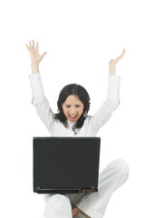 young woman rejoicing while havin a communication via internet o