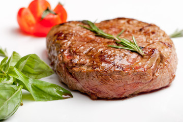 Grilled steak on a white plate