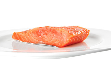 pink smoked salmon on white plate