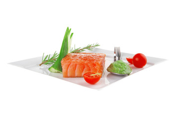 smoked salmon fillet and tomatoes with pesto sauce