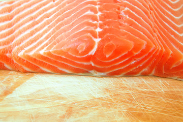 salmon fish piece over wood