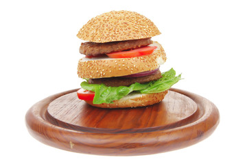 double roasted hamburger on wooden plate