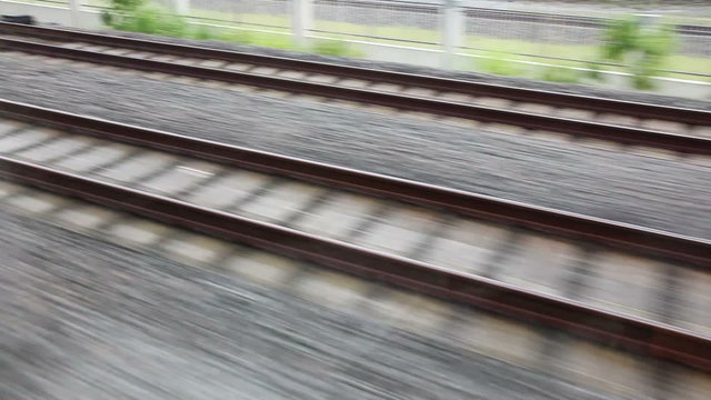 Close view of railroad track moving at high speed