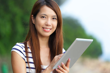 asian woman using tablet computer